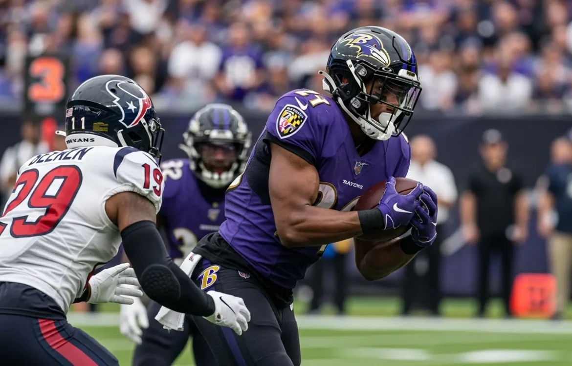 Ravens receiver holds the ball near a Texans defender. Baltimore Ravens vs Texans Match Player Stats: Complete 2026 Breakdown.