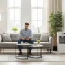 A man reviewing his monthly expenses and the average light bill for apartment on a digital tablet in a modern home.