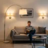 Effective lighting for apartments with no ceiling lights using stylish floor lamps and warm ambient LED strips.